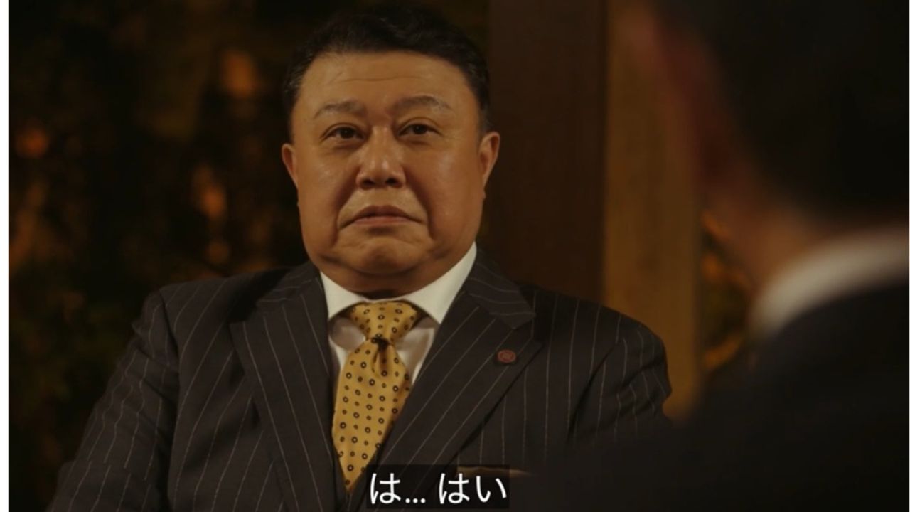 黄色いネクタイをした宇佐美部長